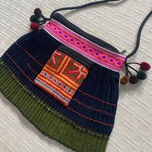 Vintage navy tweed embroidered Pom Pom purse.
